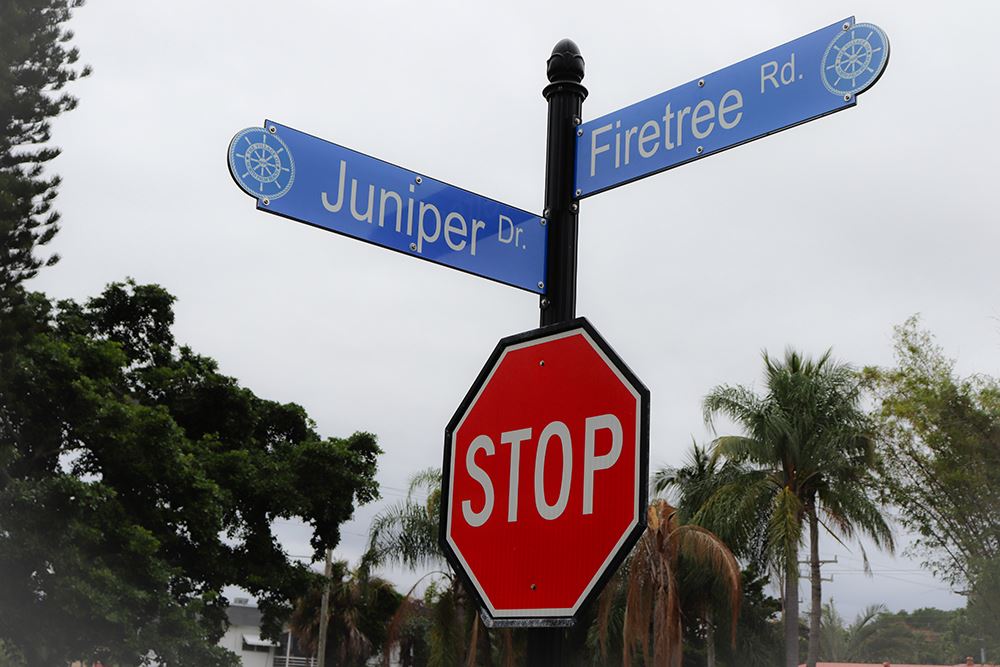 Photos of volunteers painting houses at NET event