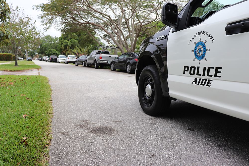 Photos of volunteers painting houses at NET event
