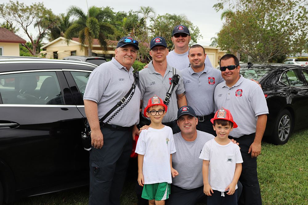Photos of volunteers painting houses at NET event