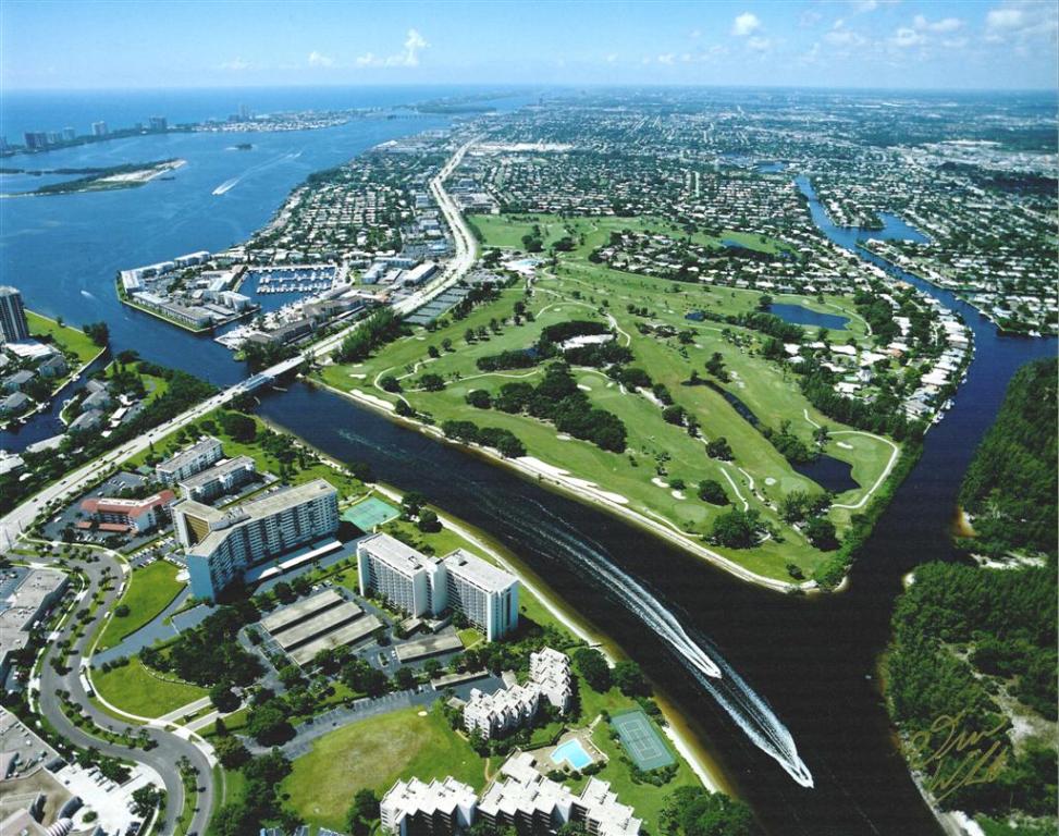 Aerial view of golf course with Intracoastal and North Palm Beach waterways, U.S 1 and Parker Bridge