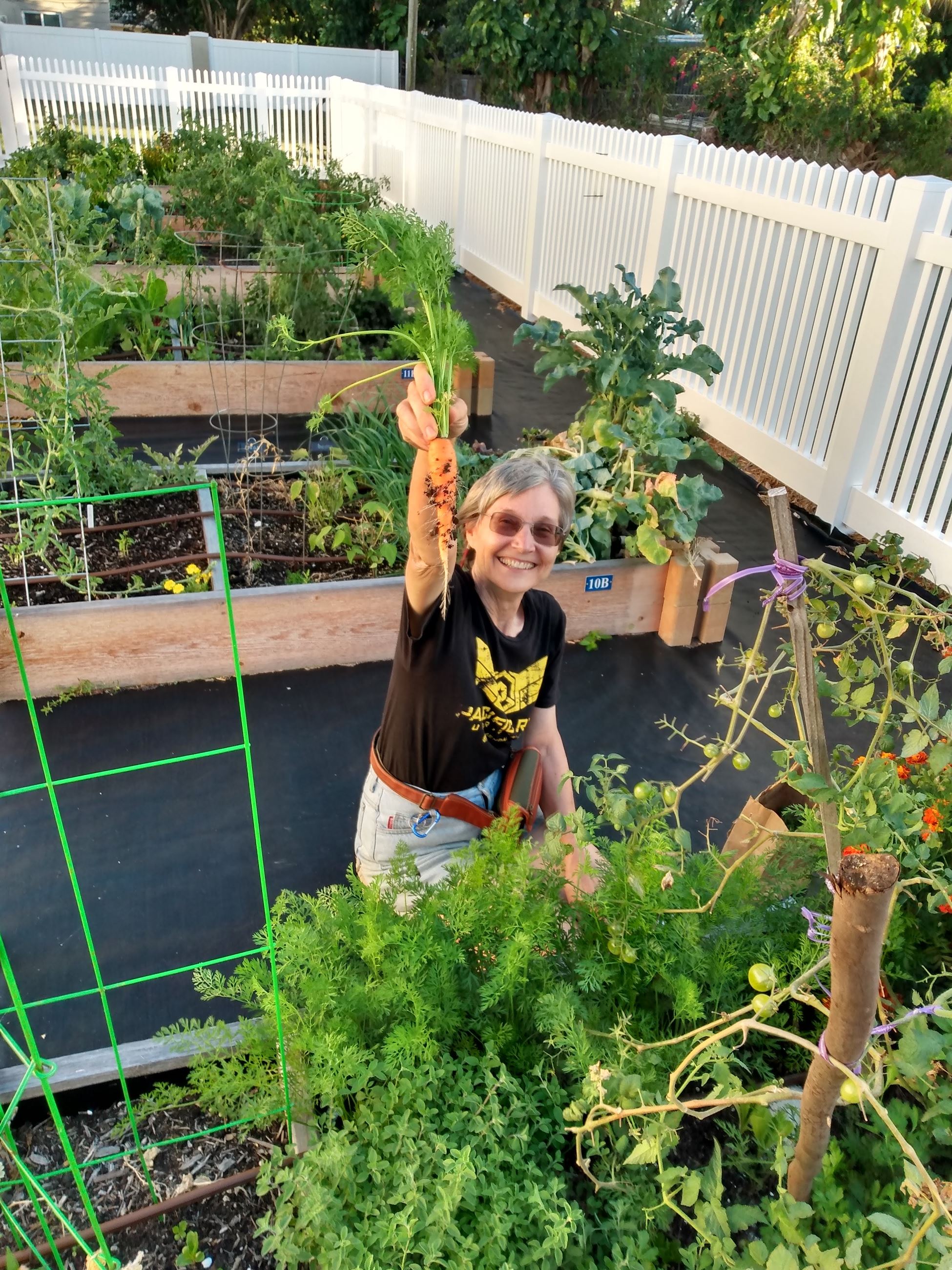 Community Garden Woman with Carrot