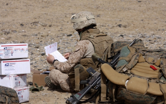 Soldier Opening a Package